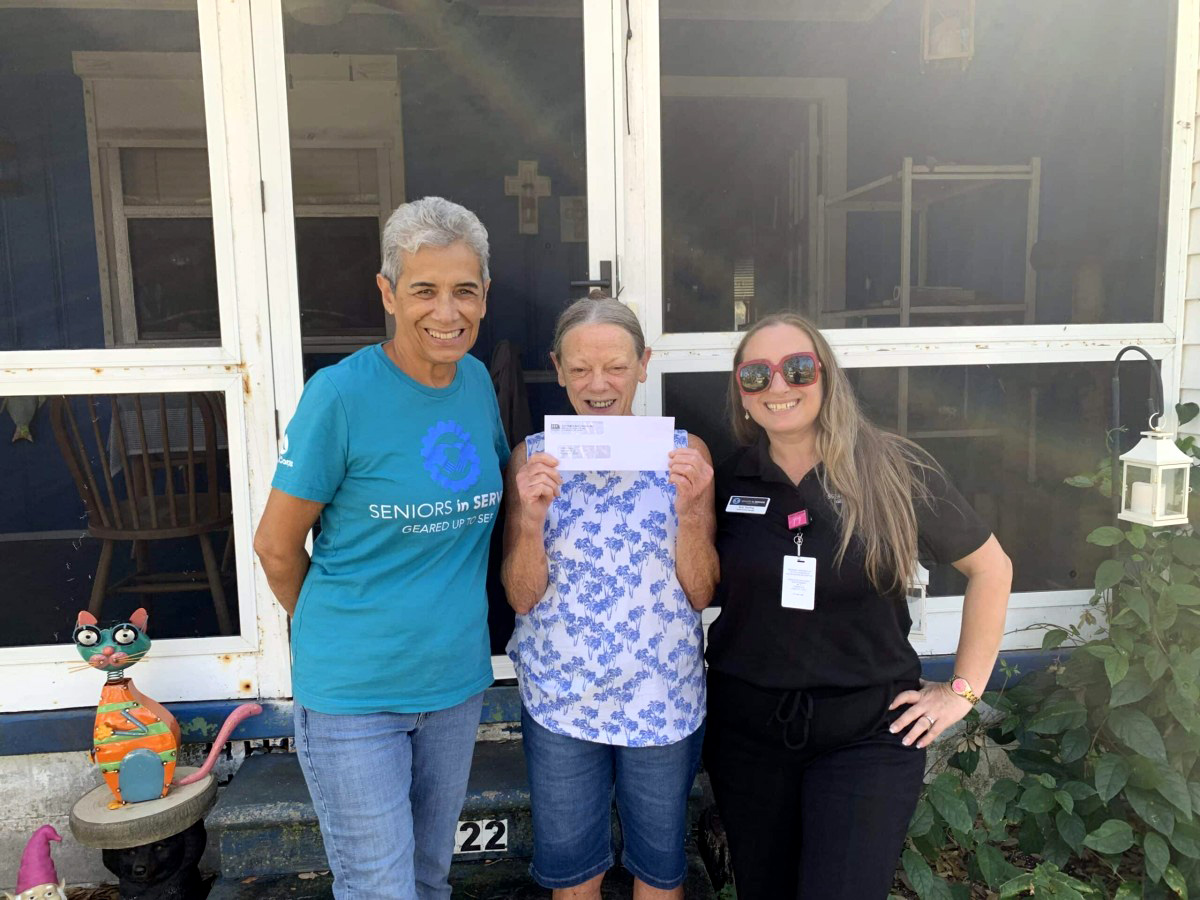 Disaster Relief Brings Hope to Hurricane Survivor Senior receives disaster relief assistance from Seniors in Service volunteers following hurricane damage in Gulfport, Florida.